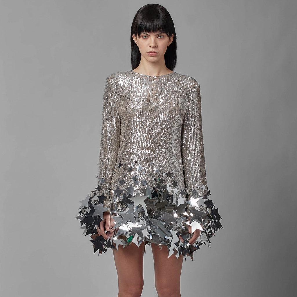 Indulge in the allure of our Dress Star - a growing star shift dress that exudes luxury. Adorned with sexy sequins and a silver mini dress design, this dress is perfect for the sophisticated woman. Elevate your style with elegance and allure.