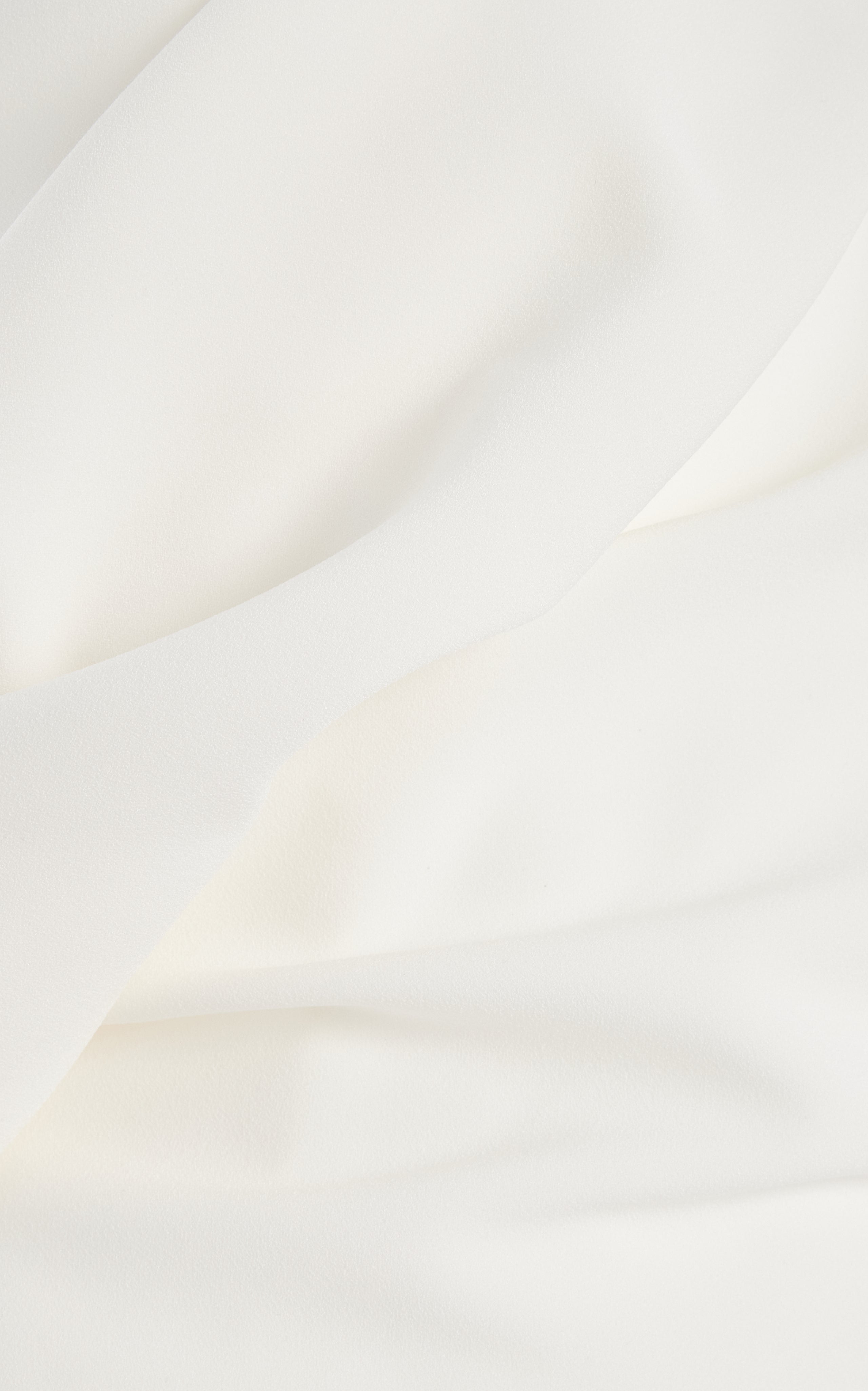 Experience the vibrant and modern aesthetic with the Maite Cape-Detailed Asymmetric Bonded Crepe Midi Dress by Roksanda. This dress features a single-shoulder cape and bold use of color, showcasing the label's expressive and dynamic use of fabrics. With its sculptural and structural design, the 'Maite' is sure to make a statement at any event.