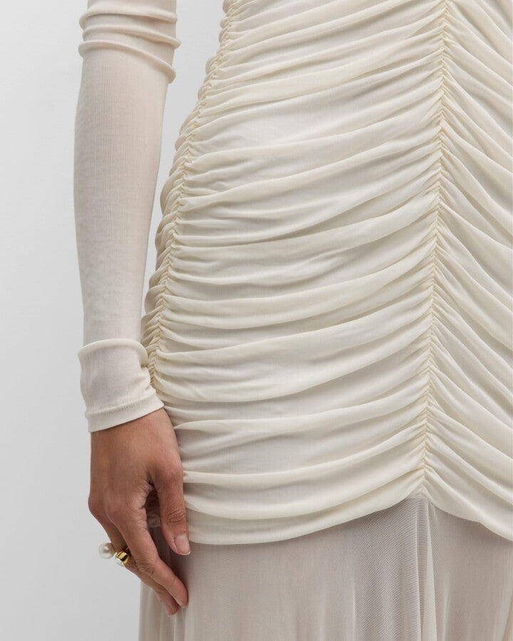 The Fawn Dress combines elegance and comfort with its jersey fabric and sheer skirt, creating a delicate, flowing silhouette. Featuring a partially lined design and a hidden back zipper closure, it offers a smooth fit and easy wear. The ruched fabric detail at both front and back adds a touch of sophistication, flattering your figure for any occasion. Perfect for those seeking a stylish, effortlessly chic look.