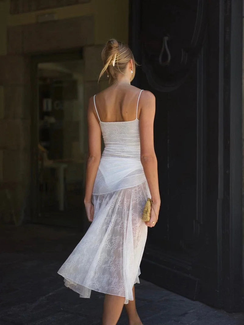 Indulge in elegance with the Adela Lace Dress. This delicate and daring piece features a feminine silhouette, sweetheart neckline, and sheer double layered lace for a charming touch. With a midi length perfect for any summer occasion, this dress exudes luxury and sophistication.