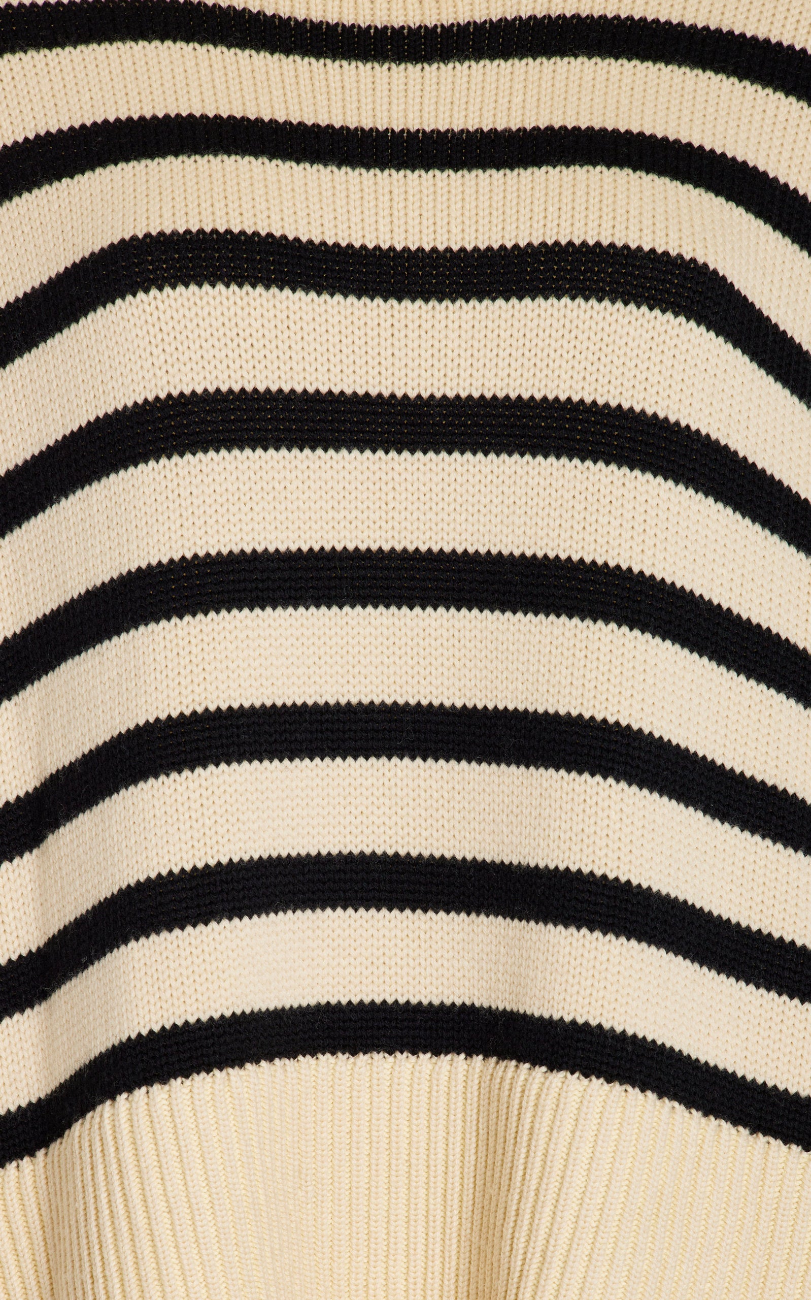 Elevate your wardrobe with the Signature Stripe Wool-Cotton Turtleneck Sweater by Totême. Blending cozy wool and breathable cotton, this sweater offers unmatched comfort and timeless style. Its clean lines and minimalist design reflect Stockholm's refined aesthetic, making it a versatile staple perfect for effortless layering. Inspired by vintage classics, this turtleneck channels modern Scandi-cool, providing a chic, everyday uniform that stands out with subtle sophistication.