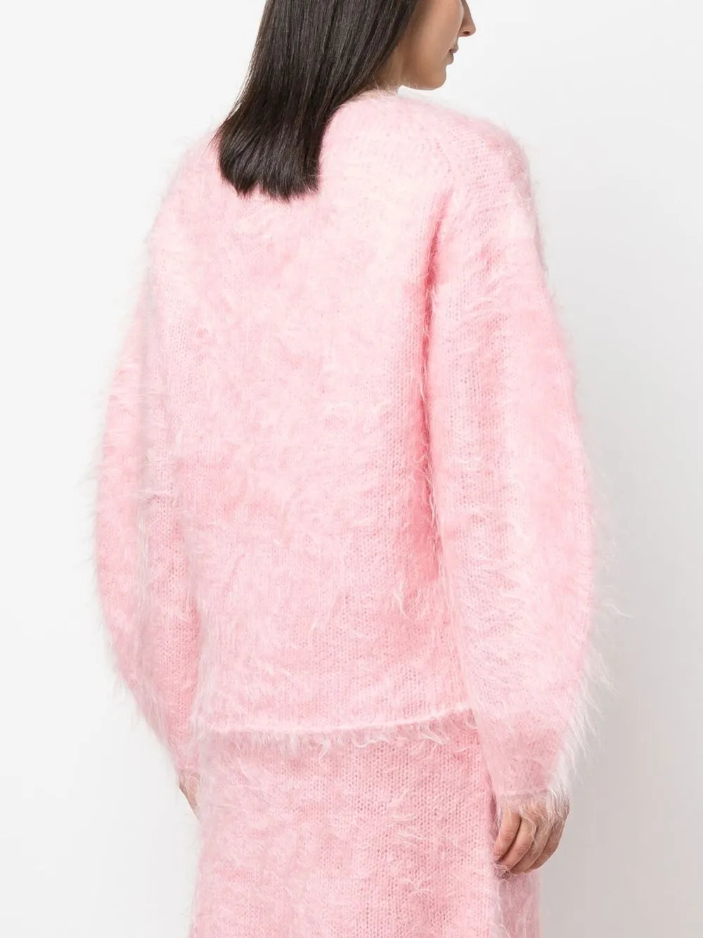 Experience luxurious comfort and style with the BY MALENE BIRGER Merino Wool Blend Set. The Hamie V-Neck Oversize Sweater boasts a cozy Mohair and Merino Wool blend in a feminine Bubble Pink color. Elevate your wardrobe and feel your best with this irresistible combination of quality and fashion.