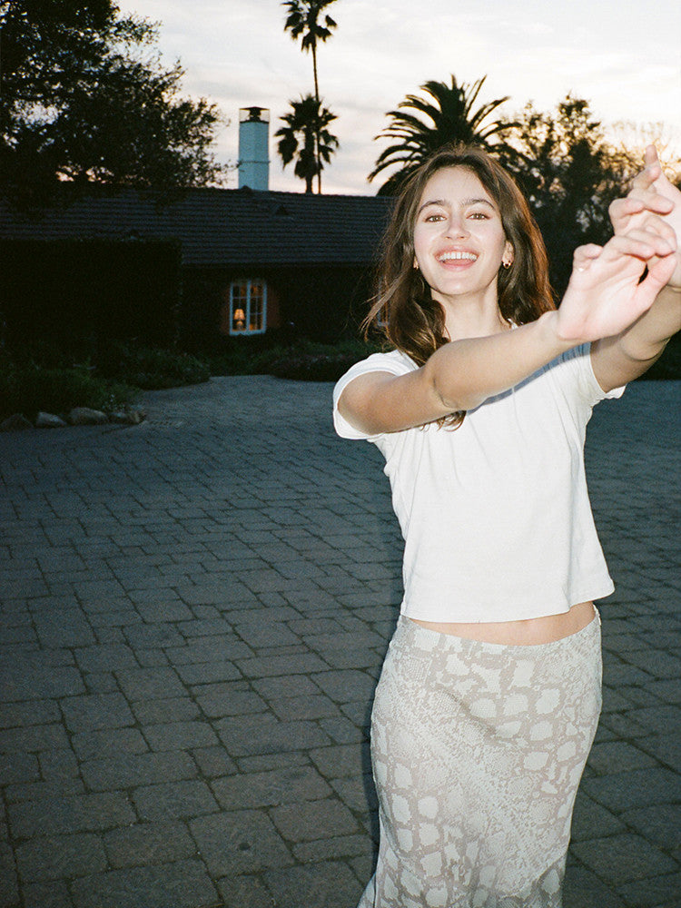 Experience the flirty and feminine charm of The Carmen in Absinthe by Realisation Par. This modern skirt features a flattering silhouette and fluted hemline that adds movement to every step. Perfect for any occasion, pair it with a fitted knit or crisp white tee for a versatile and effortless look. Indulge in classic charm with a touch of modern sophistication.