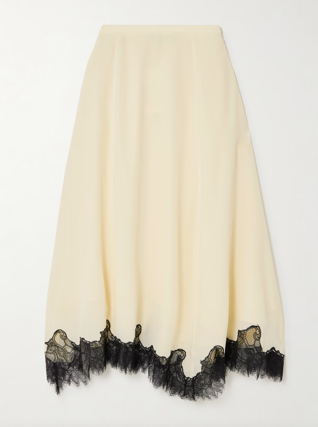 Ulla Johnson’s Rosine Midi Skirt offers timeless elegance with its fluid silk crepe de chine fabric and relaxed A-line silhouette. The delicate contrasting lace trim on the asymmetric hem adds a distinctive vintage flair. Perfectly paired with the matching Bette top, this skirt effortlessly elevates your wardrobe for both casual and special occasions.