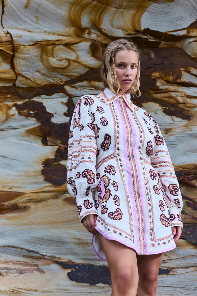 Elevate your style with the Jagger Fitted Waist Mini Dress by Antipodean. Made from luxurious linen, it boasts a hand-drawn print and balloon sleeves for a flattering silhouette. With a concealed placket, this dress is perfect for any occasion and a must-have for any wardrobe.