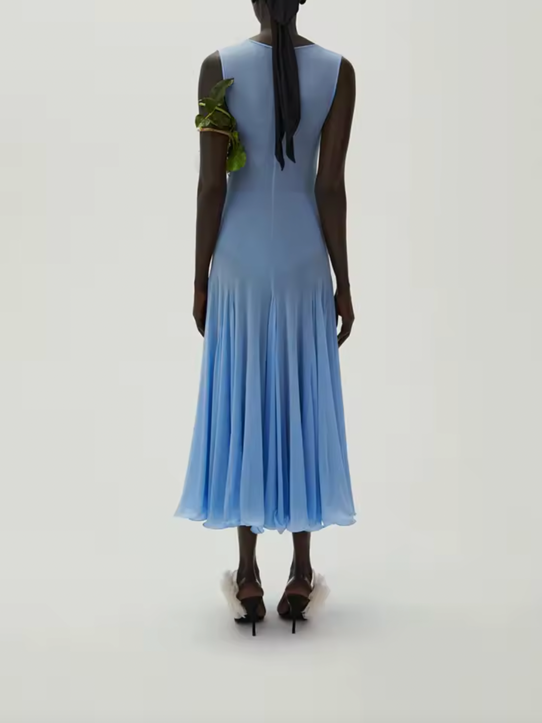 Introducing the Short Sleeve Midi Dress by Magda Butrym. Made with lightweight jersey fabric and elegant pleating, this dress drapes beautifully on your figure. Elevate your wardrobe with this luxurious piece and don't forget to consider undergarments for the sheer finish. Embrace the unexpected with Magda Butrym.