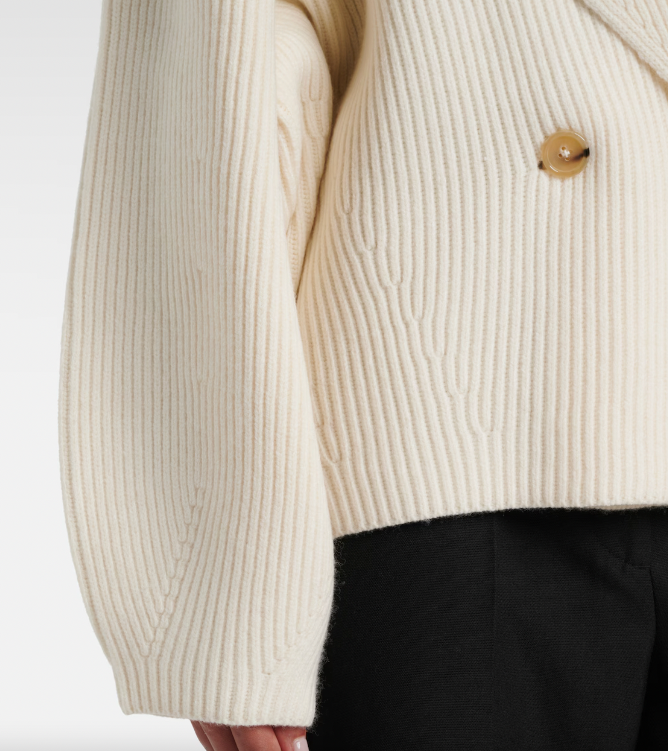 Elevate your wardrobe with this shawl-lapels cardigan from Toteme, a brand renowned for its modern, refined approach to dressing. Designed with a slightly oversized fit and rounded sleeves, it adds sophisticated volume and effortless layering to any outfit. Crafted for comfort and style, this sculptural piece is perfect for defining your personal dress code while staying cozy and polished.