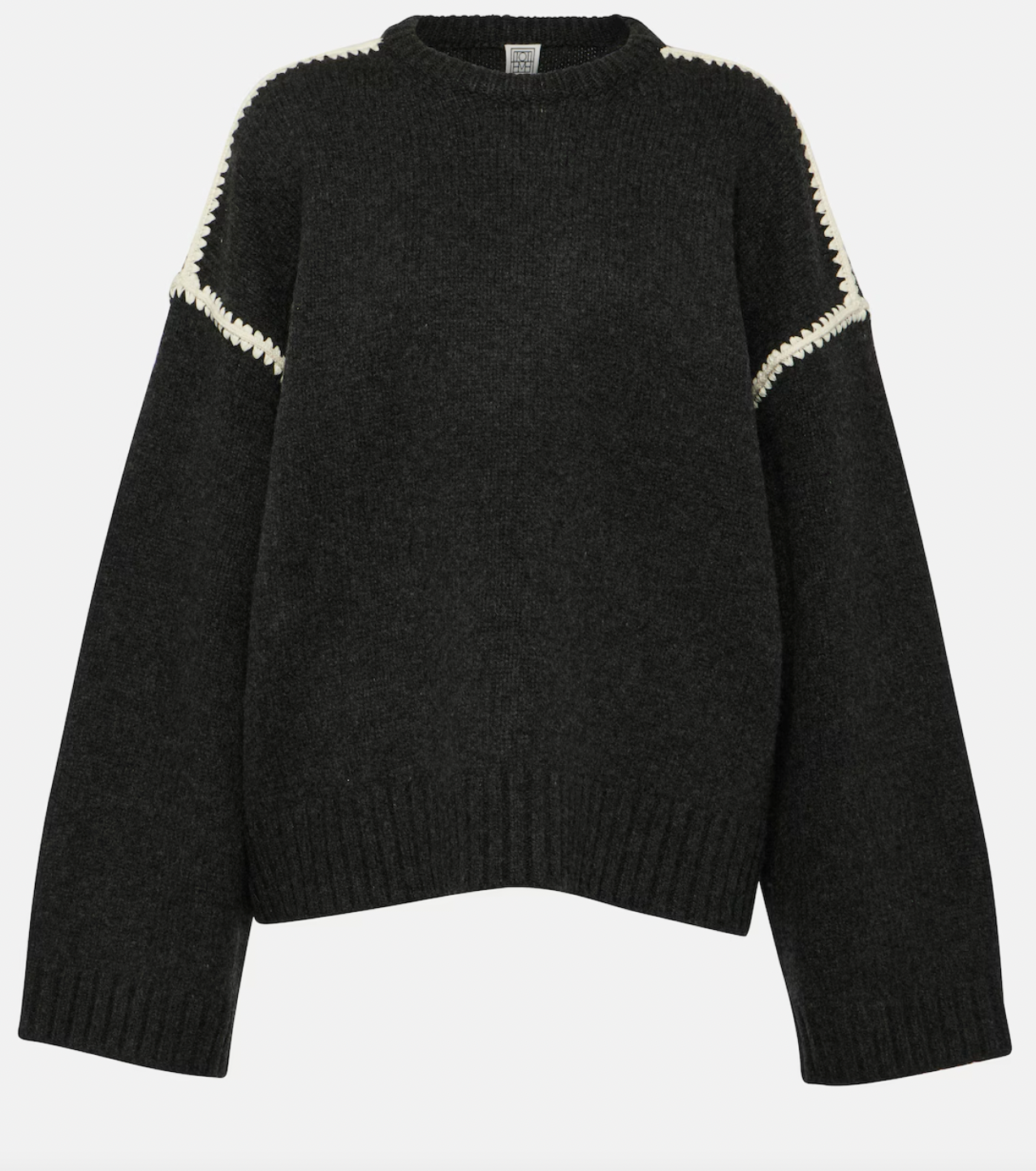 Elevate your wardrobe with this oversized sweater by Toteme crafted from a sumptuous wool and cashmere blend. Its relaxed fit with dropped shoulders offers effortless comfort, while the contrasting cream embroidery adds a refined, distinctive touch. Designed as a timeless staple, it seamlessly enriches your collection, providing both warmth and style for any occasion.