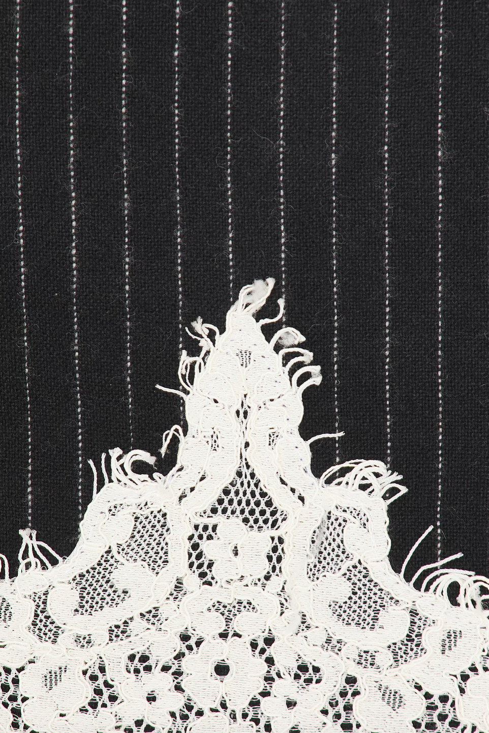 The Teddi Mini Dress combines classic pinstripes with delicate lace accents to create a look that’s both sophisticated and modern. Featuring spaghetti straps and an empire waist, it flatters your figure while the tailored yoke adds elegant shaping. The flowing A-line skirt with scalloped lace hem adds subtle charm, and the hidden side zipper ensures a smooth, comfortable fit. Perfect for any event where style and refinement are a must.