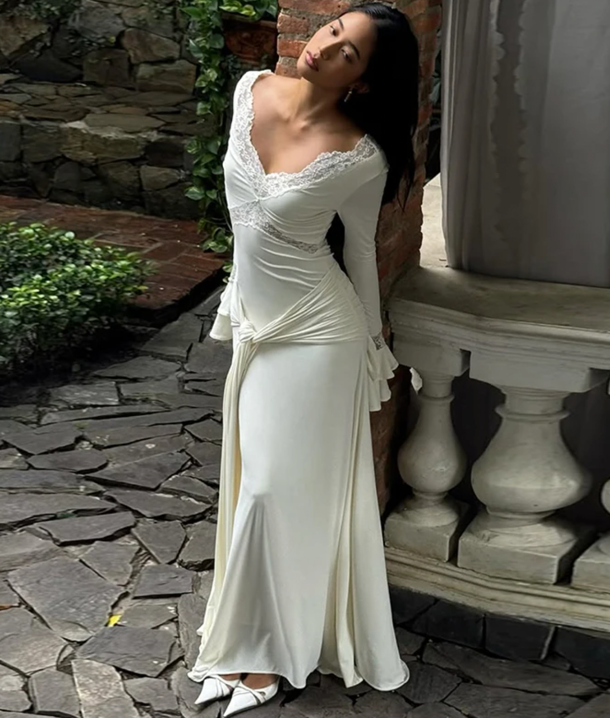 The Electra dress offers a stunning blend of elegance and allure with its fitted silhouette and intricate lace detailing. Featuring a deep V lace neckline and delicate cut-outs, this dress exudes sophistication while the cascading front-side tie adds fluidity to your movement. Flared layered sleeves contribute a vintage-inspired charm, and the partial lining ensures both comfort and style. Ideal for evening occasions, the Electra dress makes a bold and graceful statement that leaves a lasting impression.