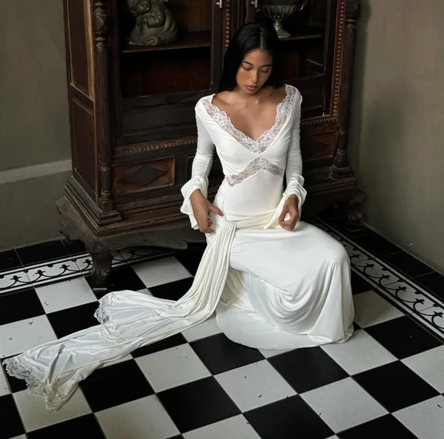 The Electra dress offers a stunning blend of elegance and allure with its fitted silhouette and intricate lace detailing. Featuring a deep V lace neckline and delicate cut-outs, this dress exudes sophistication while the cascading front-side tie adds fluidity to your movement. Flared layered sleeves contribute a vintage-inspired charm, and the partial lining ensures both comfort and style. Ideal for evening occasions, the Electra dress makes a bold and graceful statement that leaves a lasting impression.