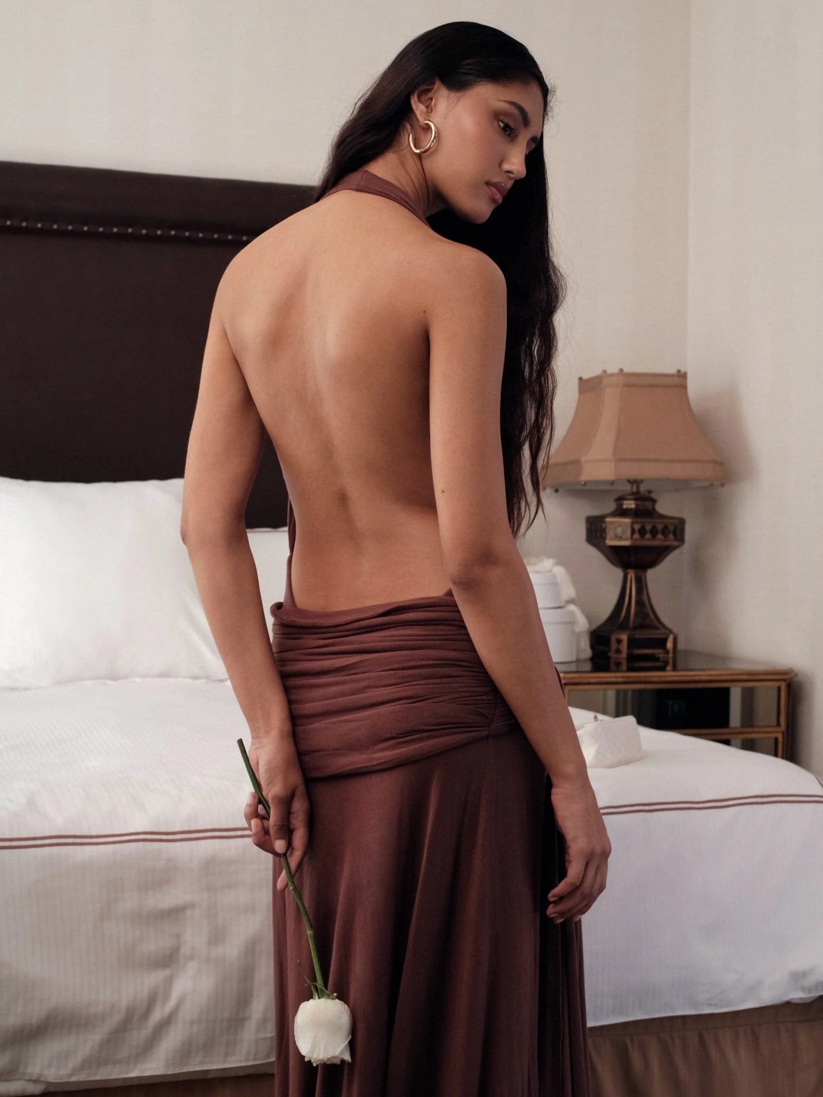 Make a grand entrance in the Halter Maxi Dress. Its figure-hugging silhouette and deep, plunging neckline exude elegance. The backless, halterneck shape adds a touch of allure. Slip on this floor-length dress with cowl front and wide hem for a luxurious, sophisticated look. Perfect for after-dark events.