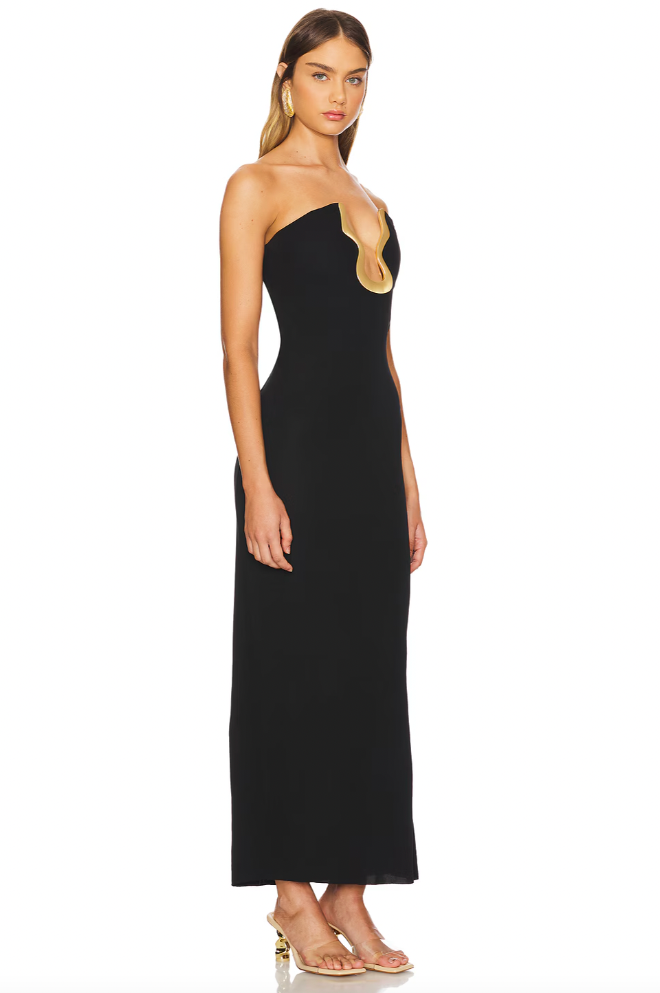 Elevate your presence with the Abril Gown, designed in smooth, silky crepe that drapes effortlessly. Its strapless bustier neckline, highlighted by delicate contrast piping, enhances your silhouette with understated elegance. Perfect for making a confident and graceful statement at any special event, this gown blends sophistication with timeless style.