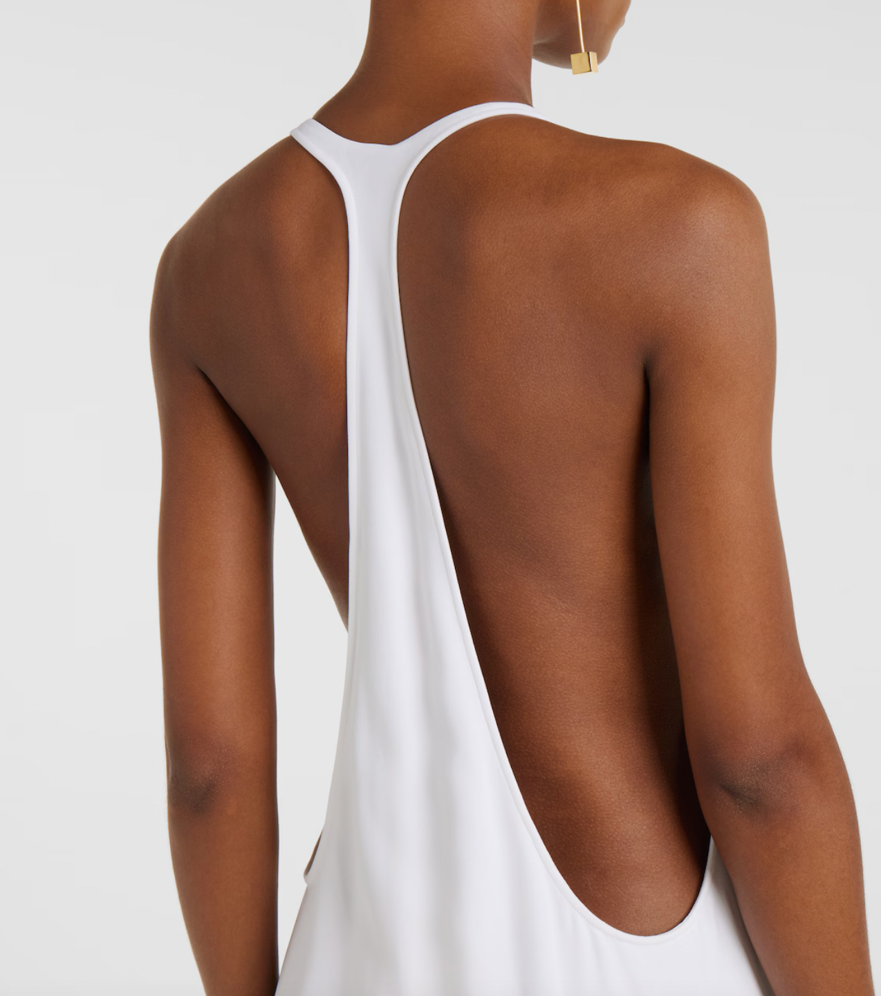 Experience timeless elegance with this Jacquemus-inspired knitted gown. Crafted in a crisp white hue, its minimalist design features a sleeveless silhouette and a graceful scoop neckline, creating a refined and effortlessly sophisticated look that flows beautifully to the floor. Perfect for those seeking understated luxury with a modern touch.