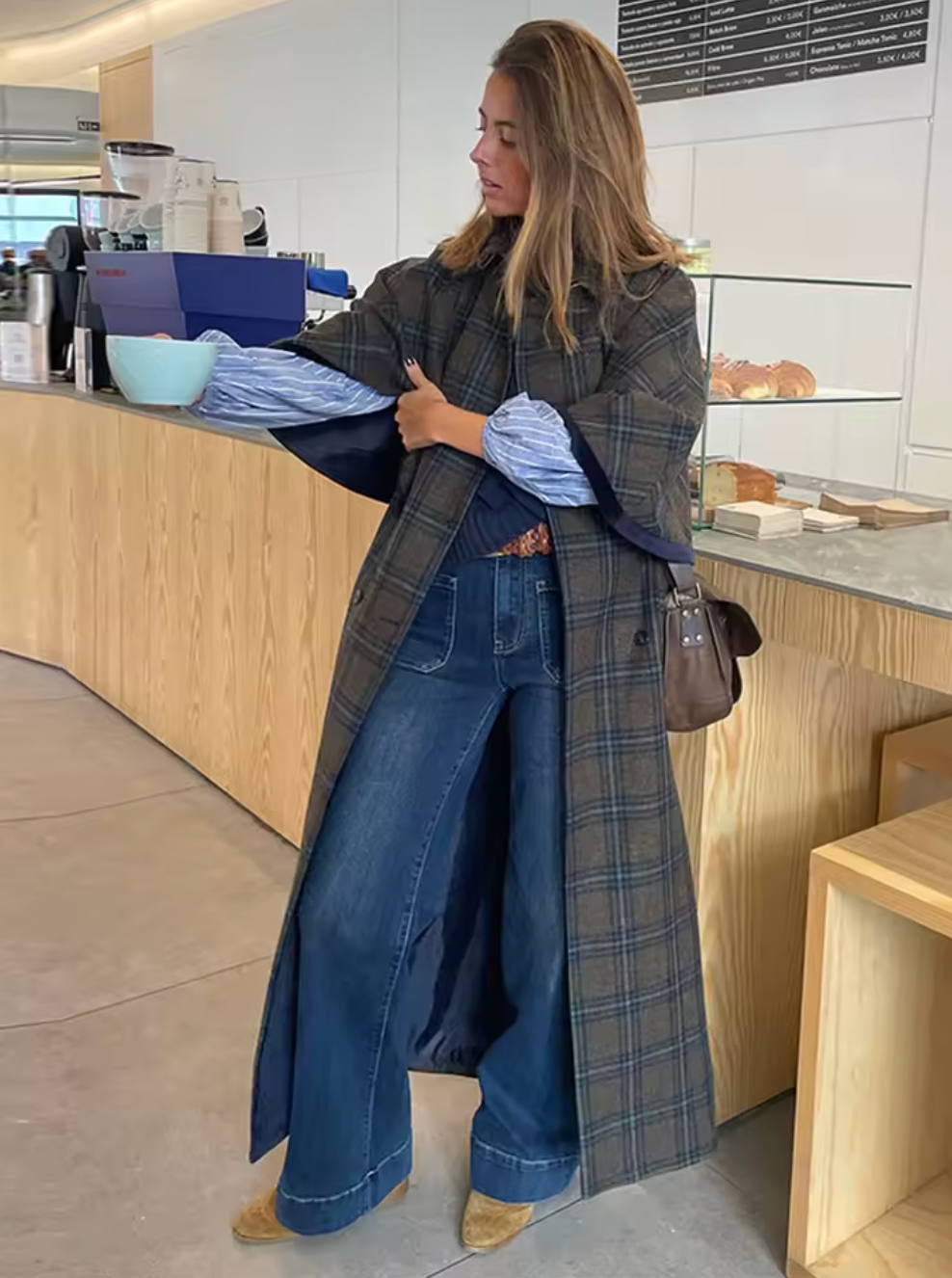 Experience timeless elegance with the Brynne Coat, crafted from a cozy wool blend for warmth and durability. Its maxi trench style features a stylish cape overlay, creating a relaxed fit that layers effortlessly over your favorite outfits. Designed to keep you comfortable on crisp autumn days, this coat blends vintage charm with contemporary flair, making it an indispensable piece for elevating your wardrobe with sophistication and comfort.