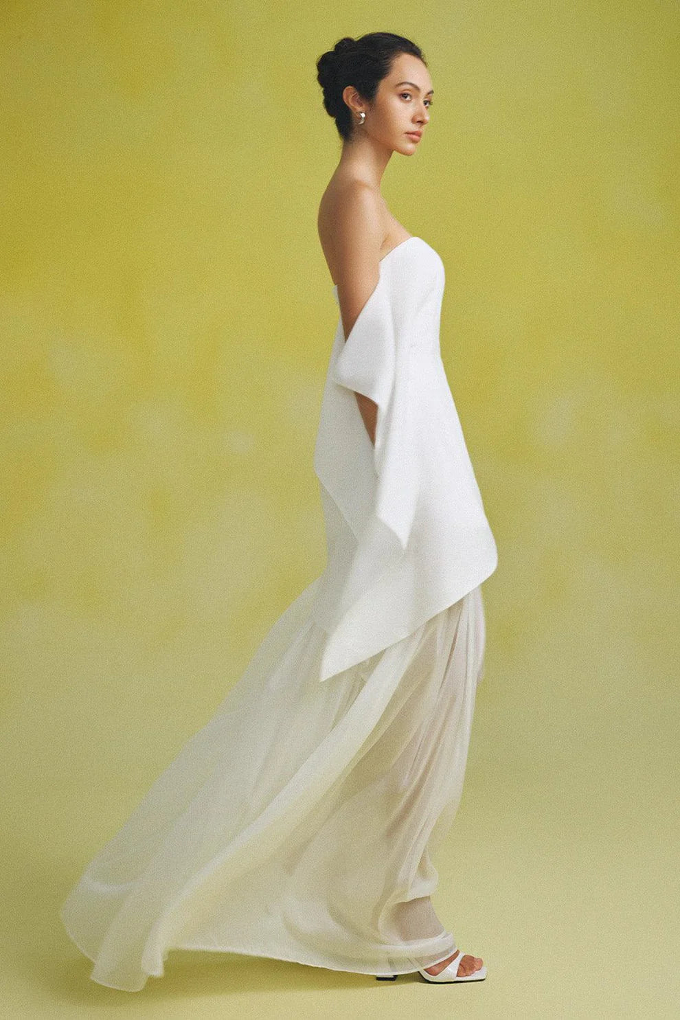 Indulge in luxury with our Gina Silk Maxi Dress. Made from premium silk chiffon, this strapless dress features elegant gatherings for a flattering and sophisticated fit. Perfect for special occasions, elevate your style with this stunning and exclusive piece.