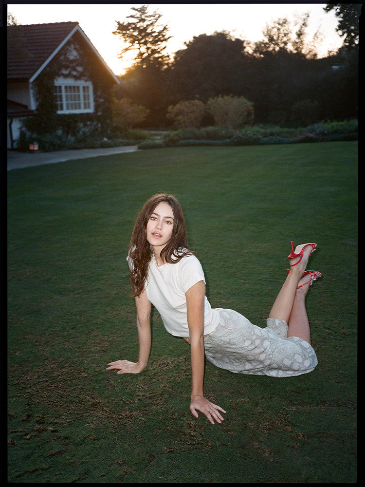 Experience the flirty and feminine charm of The Carmen in Absinthe by Realisation Par. This modern skirt features a flattering silhouette and fluted hemline that adds movement to every step. Perfect for any occasion, pair it with a fitted knit or crisp white tee for a versatile and effortless look. Indulge in classic charm with a touch of modern sophistication.