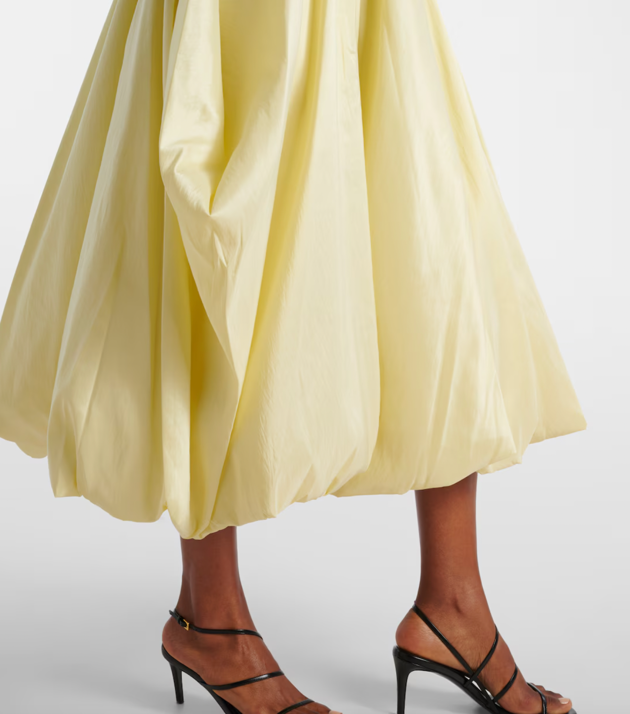 The Izzy Taffeta Midi Dress from Simkhai offers a striking blend of textures, featuring a ribbed-knit bodice that flatters your shape and a voluminous taffeta skirt that commands attention. This unique silhouette ensures you stand out effortlessly at any event, combining comfort with bold elegance for a memorable style statement.