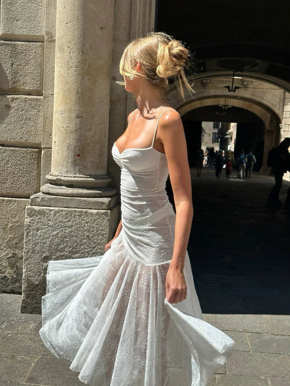 Indulge in elegance with the Adela Lace Dress. This delicate and daring piece features a feminine silhouette, sweetheart neckline, and sheer double layered lace for a charming touch. With a midi length perfect for any summer occasion, this dress exudes luxury and sophistication.