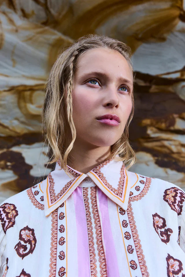 Elevate your style with the Jagger Fitted Waist Mini Dress by Antipodean. Made from luxurious linen, it boasts a hand-drawn print and balloon sleeves for a flattering silhouette. With a concealed placket, this dress is perfect for any occasion and a must-have for any wardrobe.