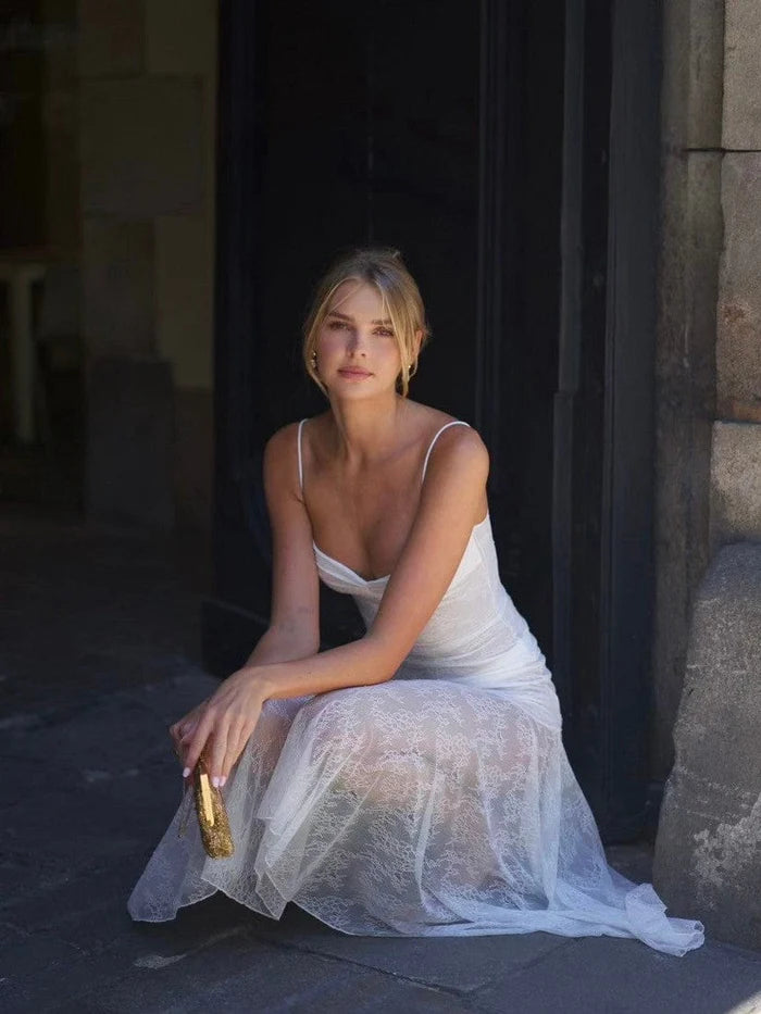 Indulge in elegance with the Adela Lace Dress. This delicate and daring piece features a feminine silhouette, sweetheart neckline, and sheer double layered lace for a charming touch. With a midi length perfect for any summer occasion, this dress exudes luxury and sophistication.