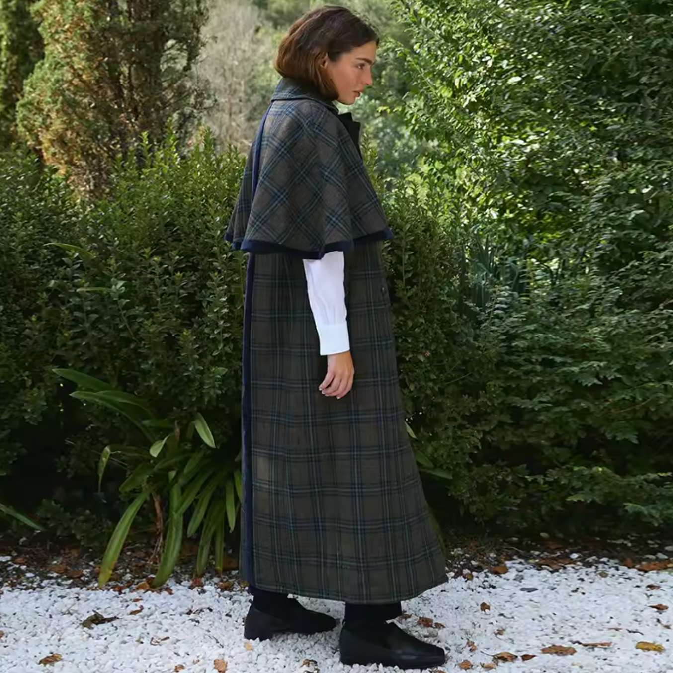 Experience timeless elegance with the Brynne Coat, crafted from a cozy wool blend for warmth and durability. Its maxi trench style features a stylish cape overlay, creating a relaxed fit that layers effortlessly over your favorite outfits. Designed to keep you comfortable on crisp autumn days, this coat blends vintage charm with contemporary flair, making it an indispensable piece for elevating your wardrobe with sophistication and comfort.