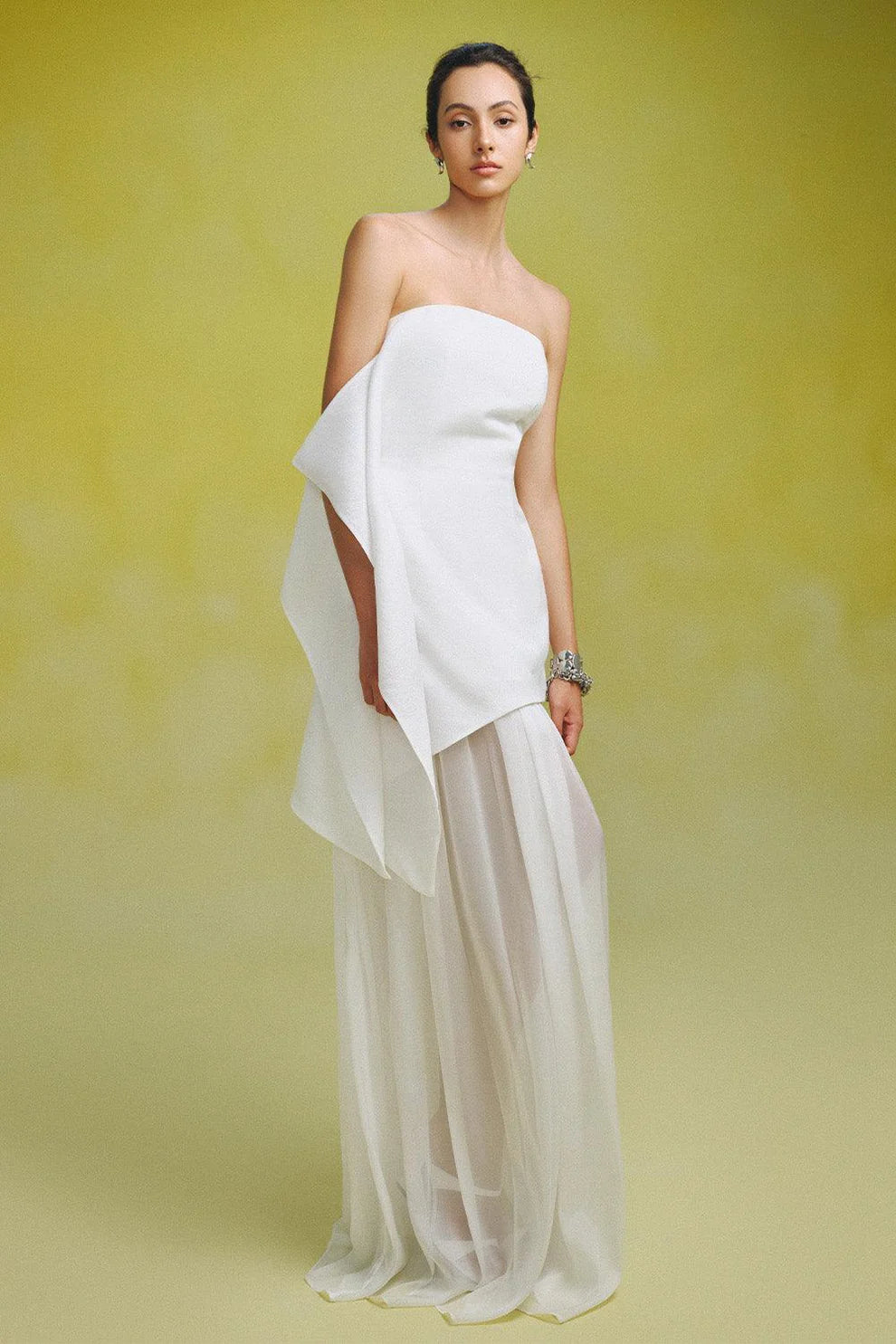 Indulge in luxury with our Gina Silk Maxi Dress. Made from premium silk chiffon, this strapless dress features elegant gatherings for a flattering and sophisticated fit. Perfect for special occasions, elevate your style with this stunning and exclusive piece.