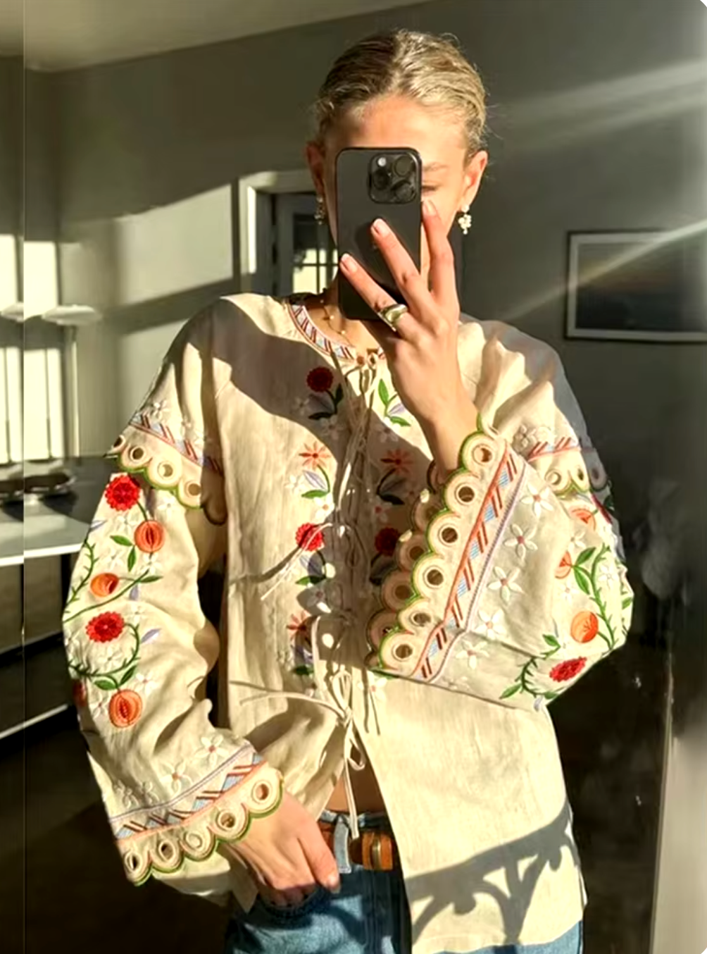 Get ready to turn heads with the Leena Embroidered Blouse! This stylish blouse features a beautiful 3D flower embroidery, flared sleeves, and a chic lace-up neckline. Embrace your unique fashion sense with this vintage-inspired piece.