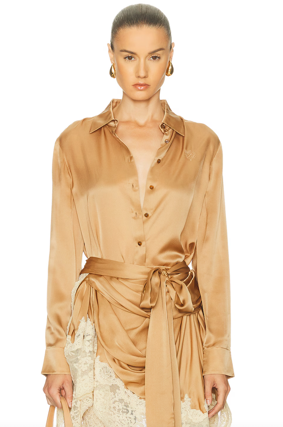 The Hypnotic Satin Shirt by Zimmermann blends effortless elegance with subtle details. Its lightweight satin fabric offers a smooth, breathable feel, perfect for all-day comfort. Featuring a front button closure and button cuffs, this shirt delivers a refined fit. The delicate embroidered logo on the front adds a touch of sophistication, making it an ideal choice for both casual and polished looks. Elevate your wardrobe with this versatile, stylish piece.