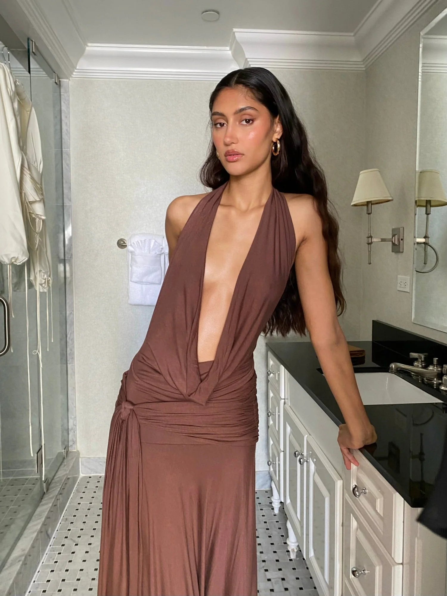 Make a grand entrance in the Halter Maxi Dress. Its figure-hugging silhouette and deep, plunging neckline exude elegance. The backless, halterneck shape adds a touch of allure. Slip on this floor-length dress with cowl front and wide hem for a luxurious, sophisticated look. Perfect for after-dark events.