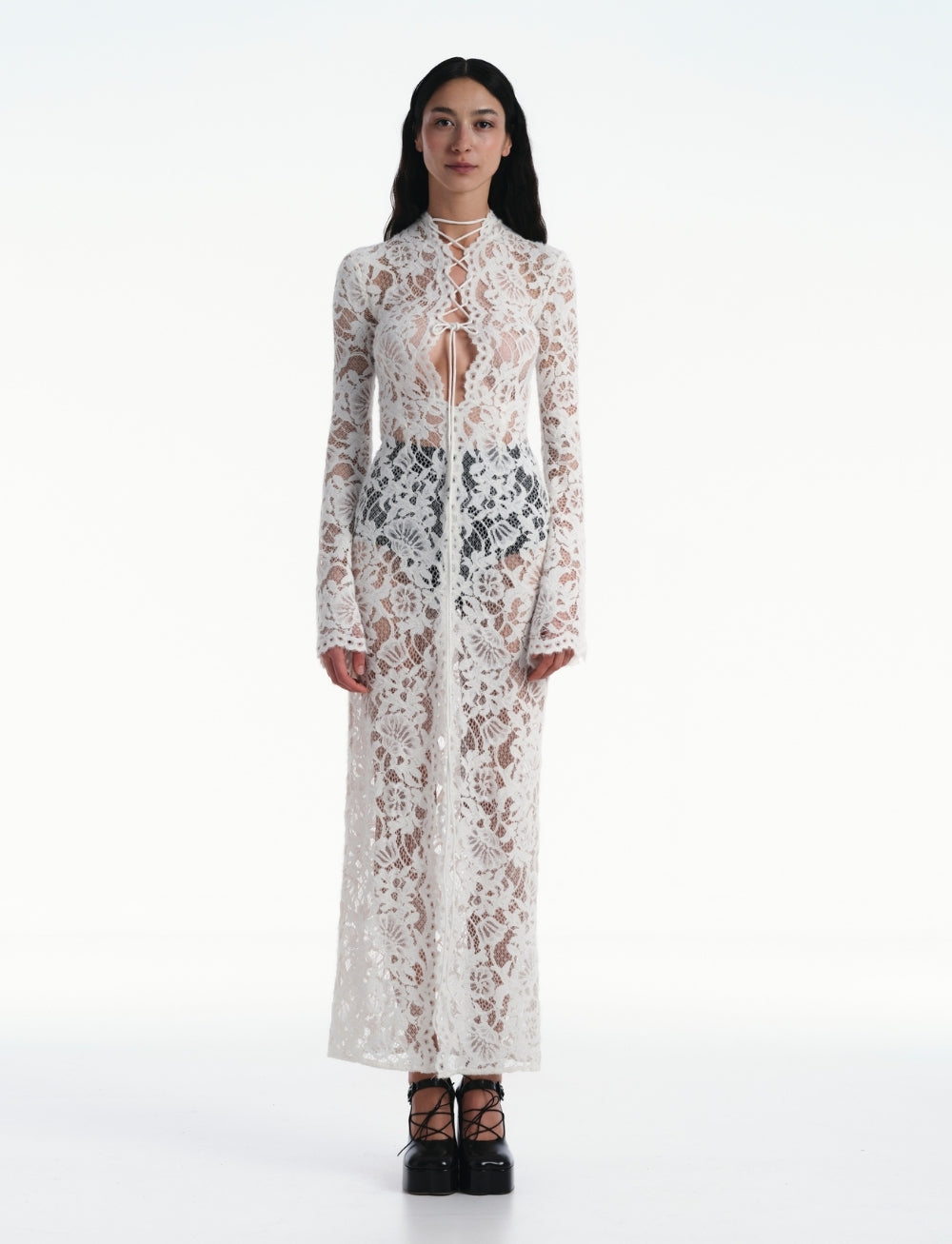 Discover your inner rebel with the Sally lace midi dress! Dare to stand out in this black stunner featuring intricate lace and semi-sheer fabric. Edgy cut-out and lace-up details, along with a front slit and straight hem, take your style to the next level. Are you ready for the adventure? This dress has got you covered!