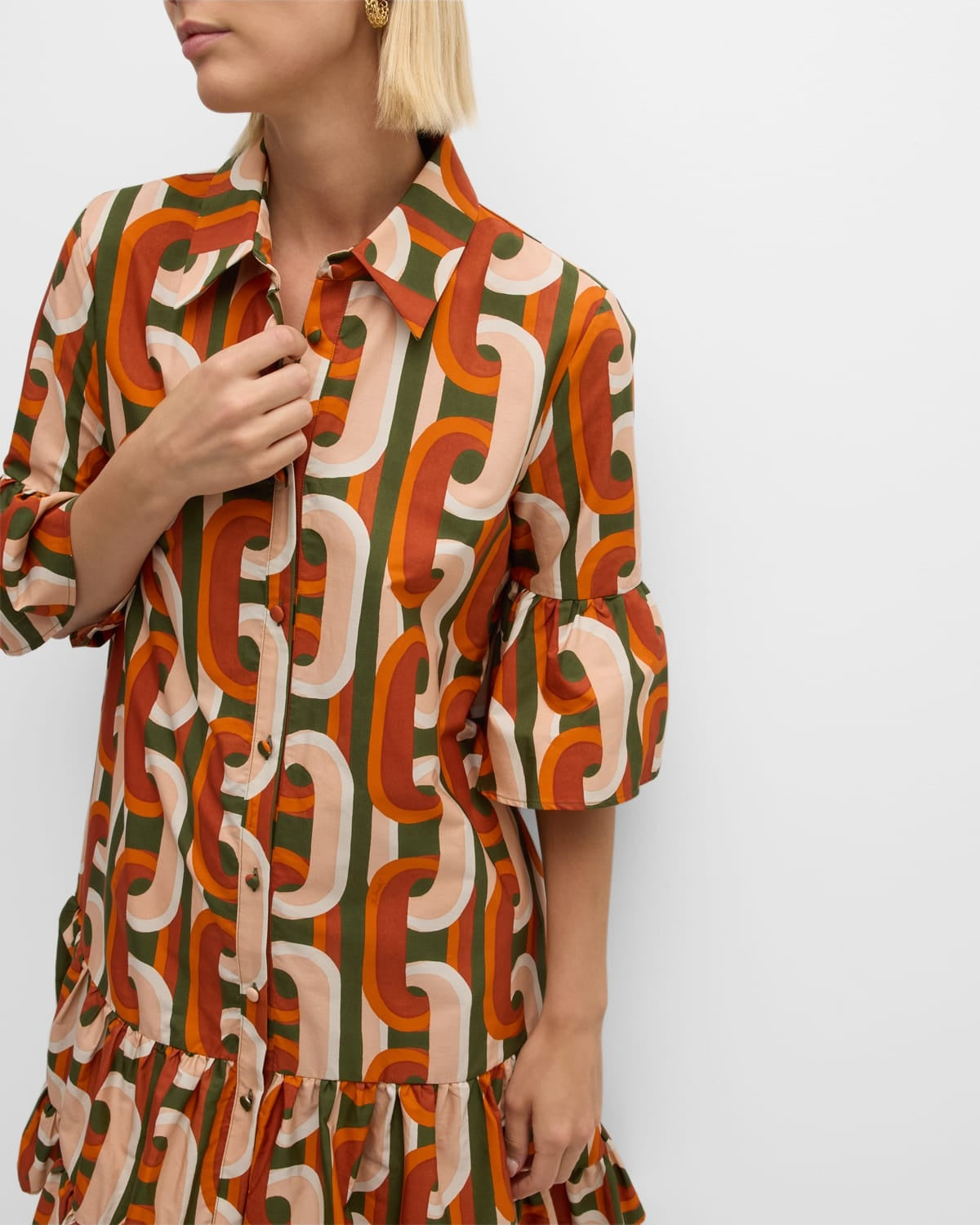 Elevate your everyday wardrobe with the DoubleJ Choux shirtdress, a sophisticated Italian-crafted piece that effortlessly transitions from day to night. This cotton mini dress features an eye-catching chain-link print and charming tiered ruffle hem that adds movement and dimension. The classic point collar and button-front design offer timeless appeal, while practical side split pockets keep essentials within reach. 