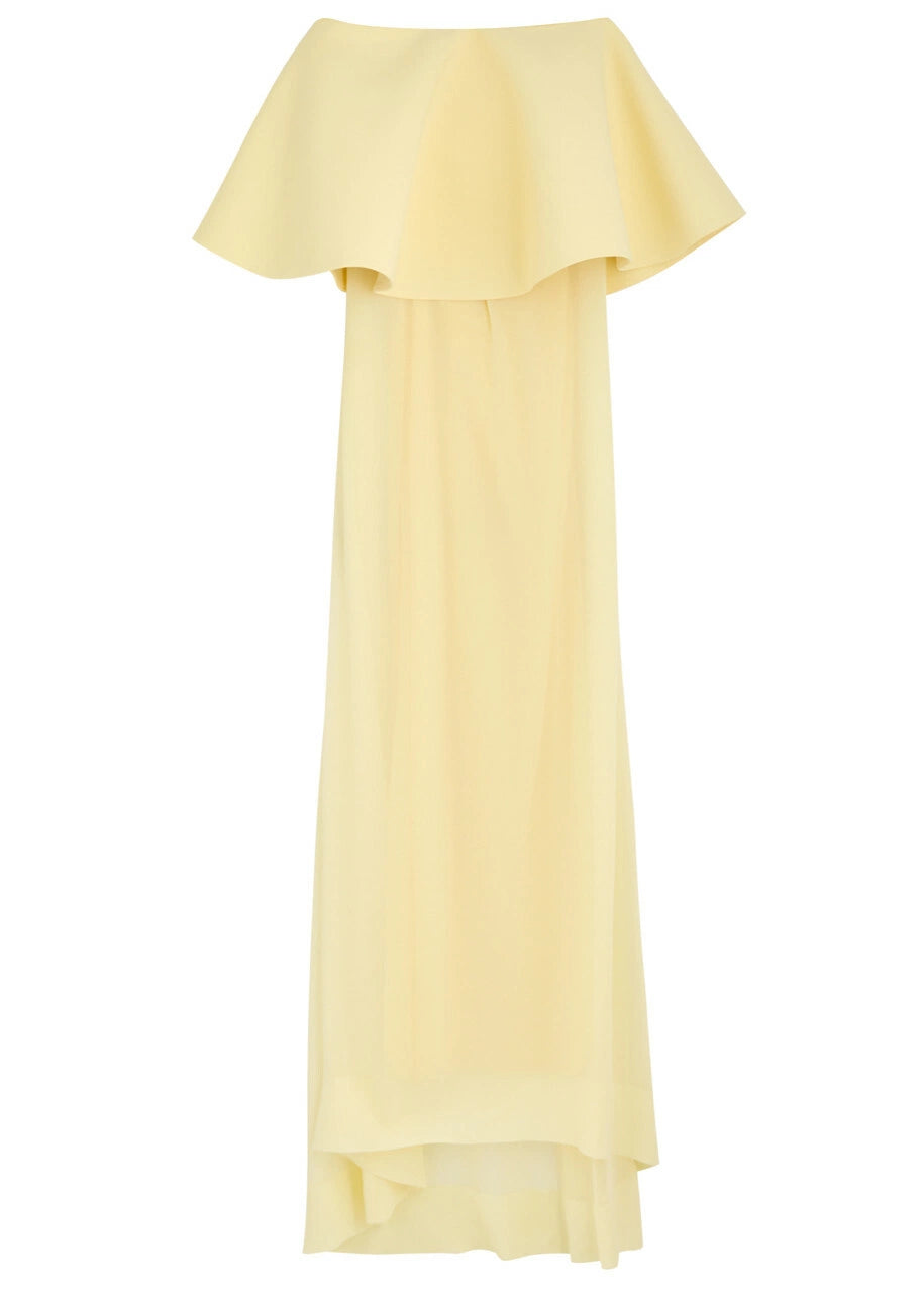The La Robe Vela Strapless Chiffon Gown in Yellow Light by Jacquemus embodies modern elegance with its flowing, loose silhouette. Designed with a boned bodice for structure and a striking contrasting flared overlay at the bust, this gown offers a sophisticated yet effortless look perfect for making a statement. Its lightweight chiffon fabric drapes beautifully, ensuring comfort and grace for any occasion. Embrace refined style with this standout piece from Jacquemus’s AW24 collection.