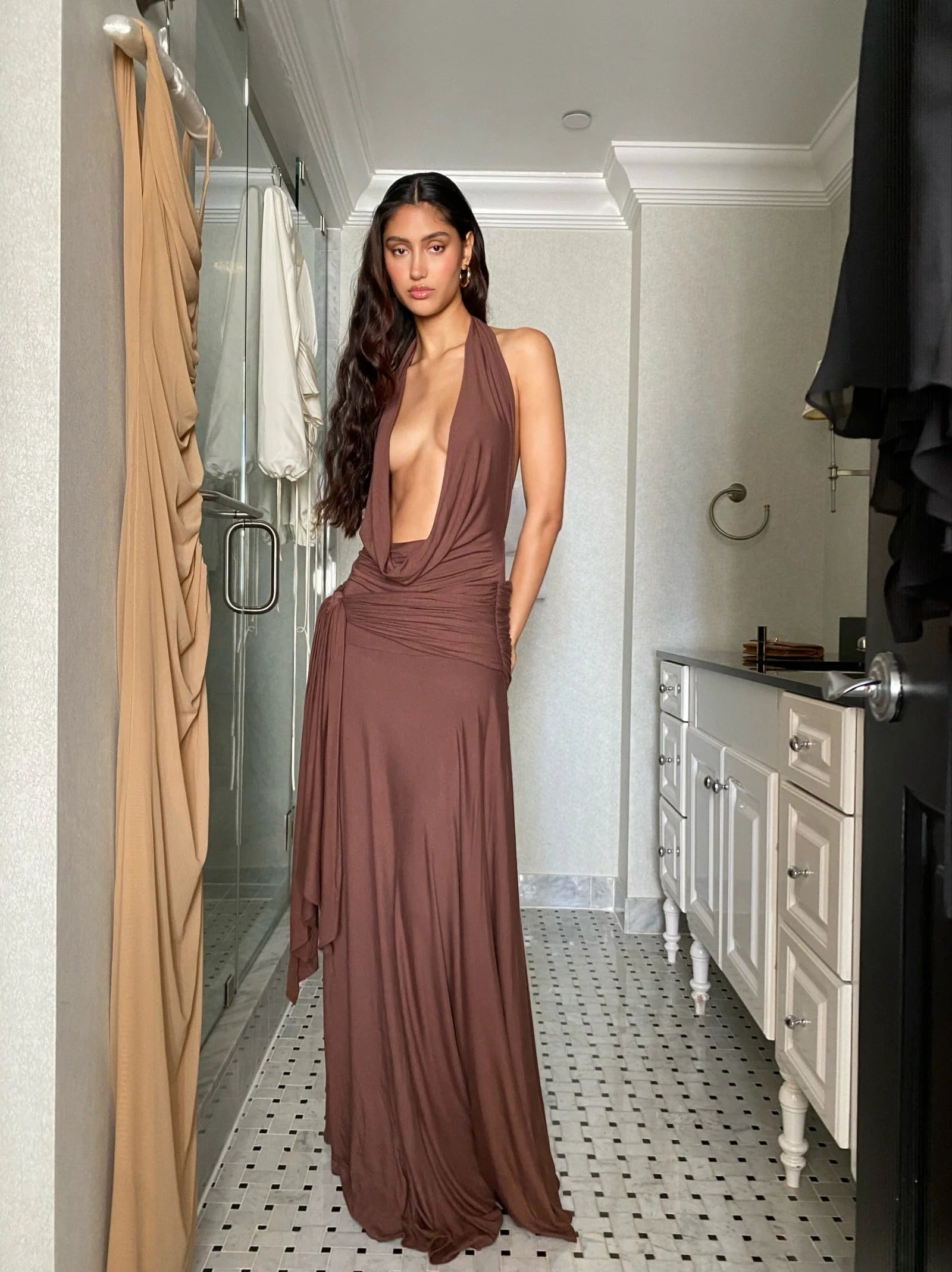 Make a grand entrance in the Halter Maxi Dress. Its figure-hugging silhouette and deep, plunging neckline exude elegance. The backless, halterneck shape adds a touch of allure. Slip on this floor-length dress with cowl front and wide hem for a luxurious, sophisticated look. Perfect for after-dark events.