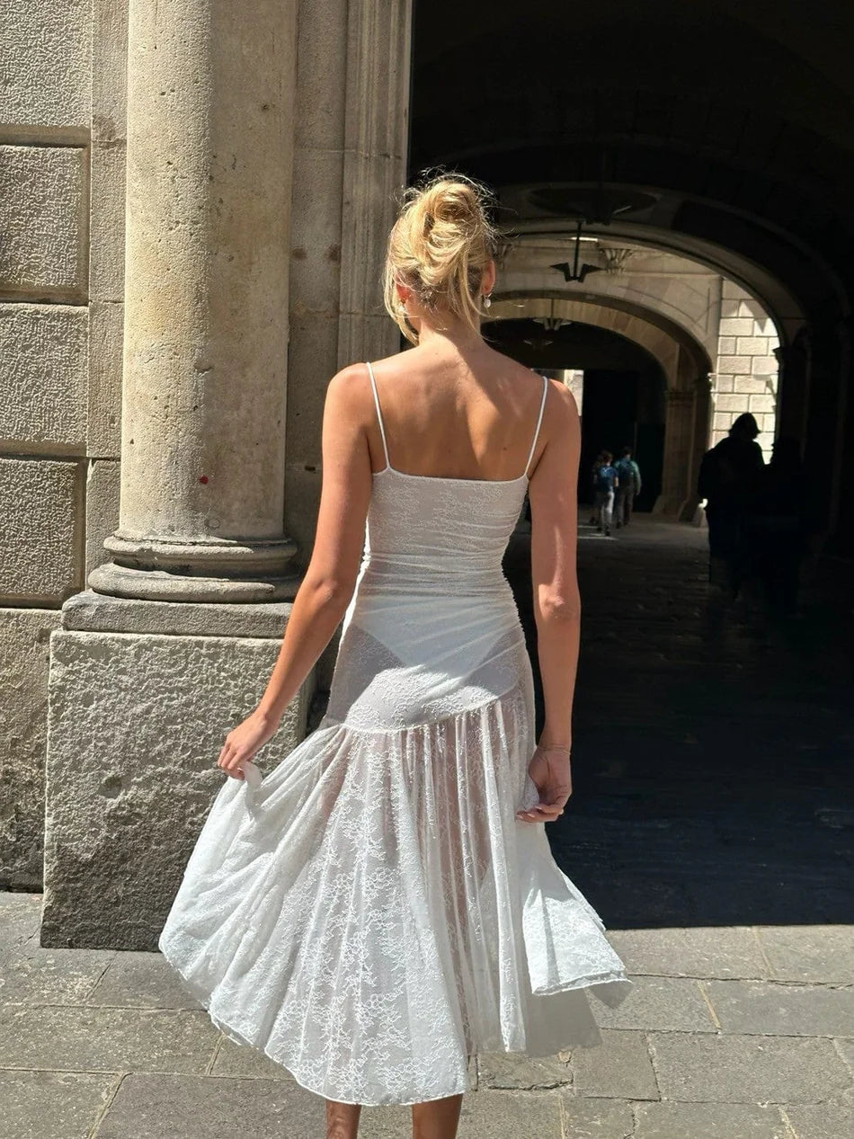 Indulge in elegance with the Adela Lace Dress. This delicate and daring piece features a feminine silhouette, sweetheart neckline, and sheer double layered lace for a charming touch. With a midi length perfect for any summer occasion, this dress exudes luxury and sophistication.