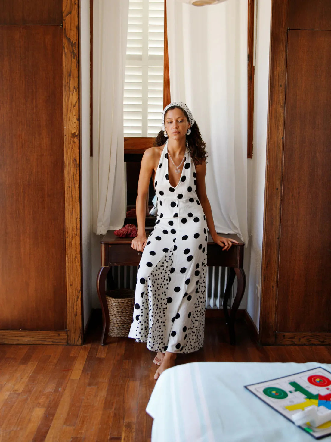 Embrace summer elegance with the Maria Dress, a sleeveless halter maxi featuring a playful dot print and lace-up back for a stunning, backless look. Perfect for vacations or warm evenings, its flowing fabric ensures comfort and style while turning heads wherever you go. Make every moment memorable in this effortlessly graceful dress.