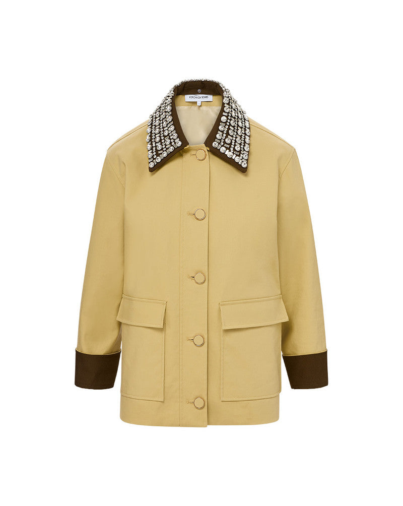 The Arlen Dickey Coat is expertly tailored from soft, 100% cotton for a lightweight and transitional piece. With a relaxed, boxy fit and oversized flap pockets, it offers both style and practicality. But the real showstopper? The detachable collar adorned with dazzling rhinestones, adding a touch of glamour and elevating any outfit.