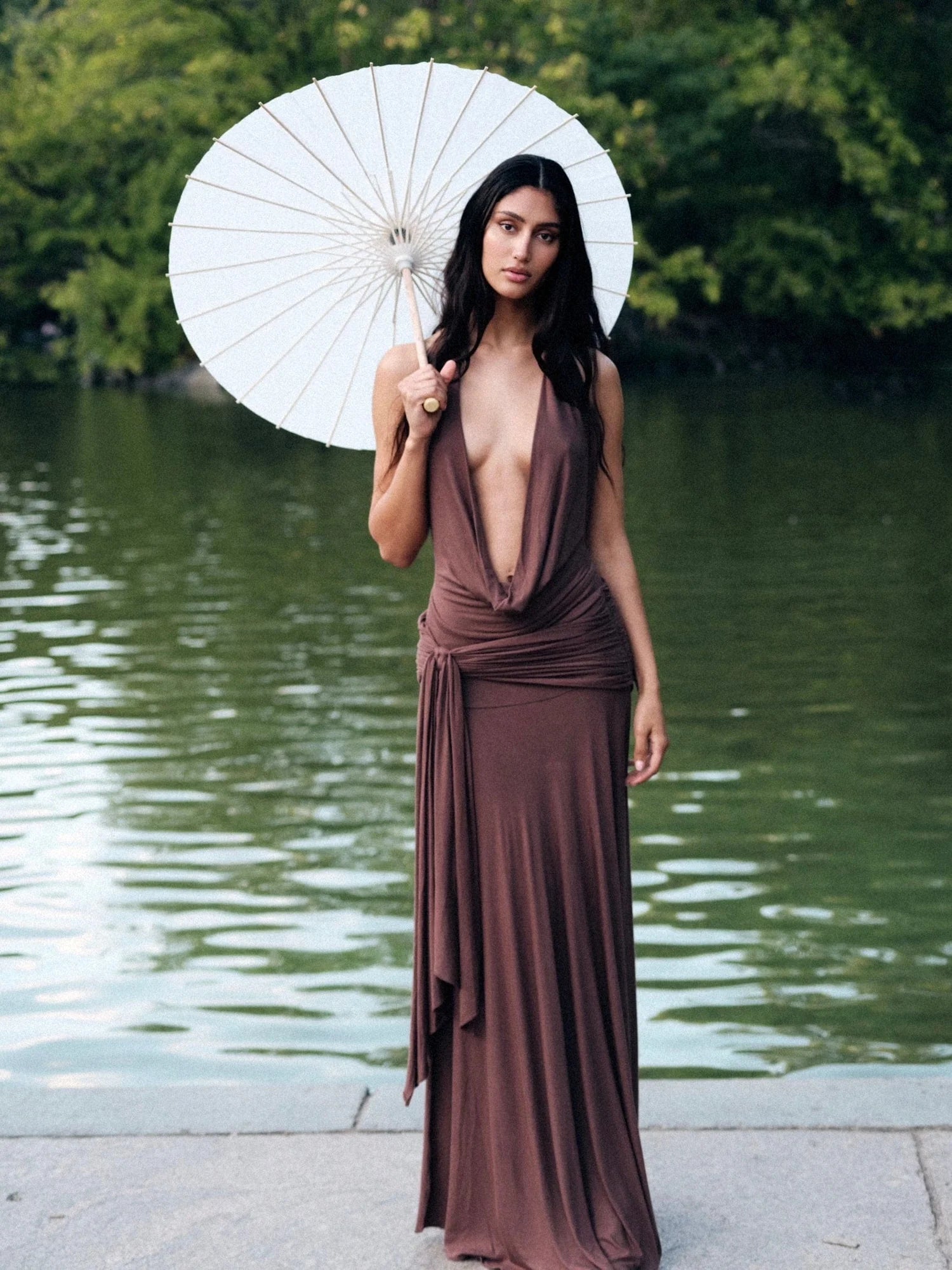 Make a grand entrance in the Halter Maxi Dress. Its figure-hugging silhouette and deep, plunging neckline exude elegance. The backless, halterneck shape adds a touch of allure. Slip on this floor-length dress with cowl front and wide hem for a luxurious, sophisticated look. Perfect for after-dark events.