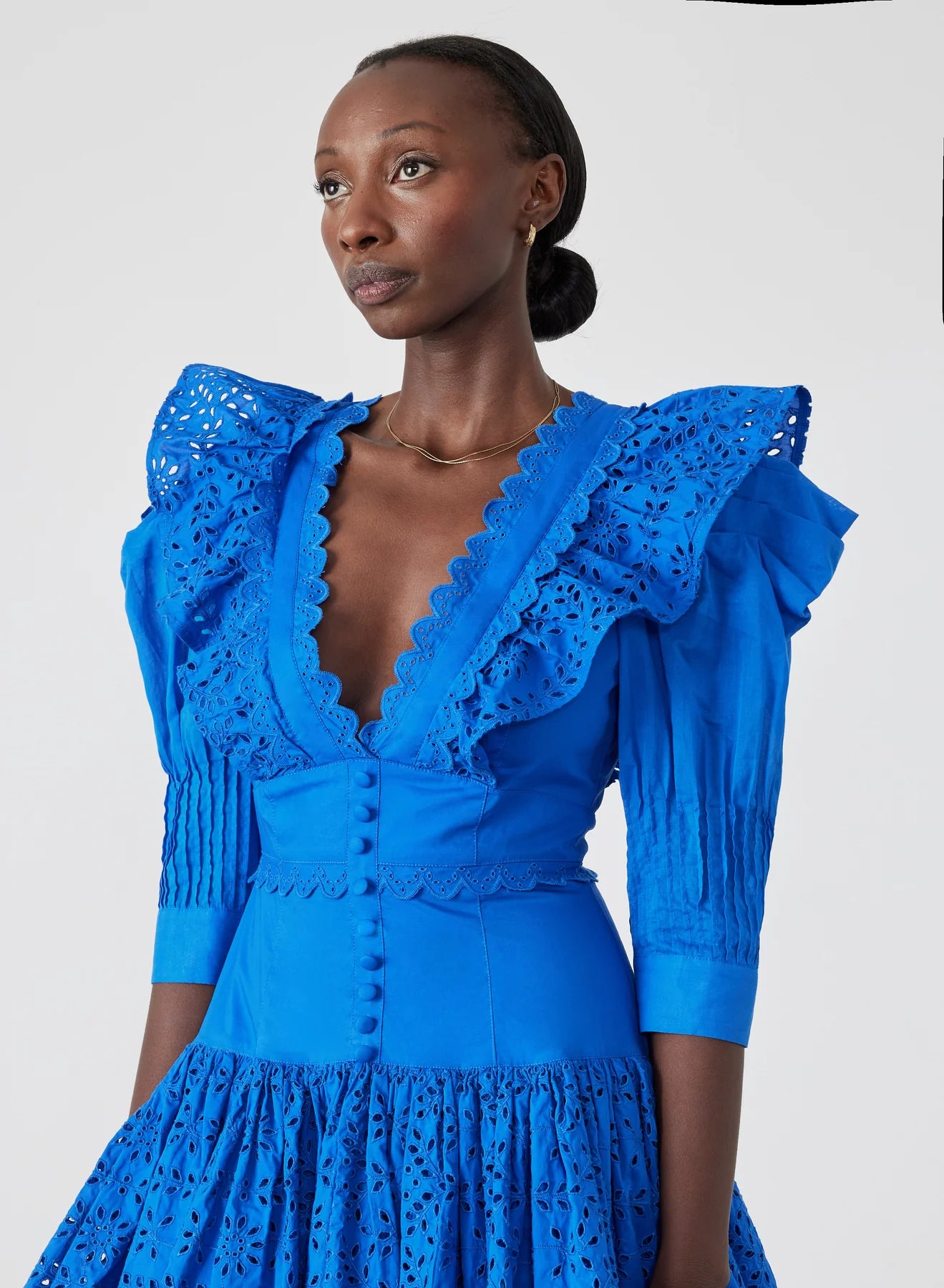 Elevate your style with Viktoria Broderie Mini Dress by Joslin. This certified organic cotton poplin dress embraces timeless charm and modern sophistication, perfect for the contemporary woman. Featuring a modest plunge neckline, contrast cotton broderie details, and stunning structured cotton organdy mutton sleeves, Viktoria exudes classic elegance with a touch of allure.