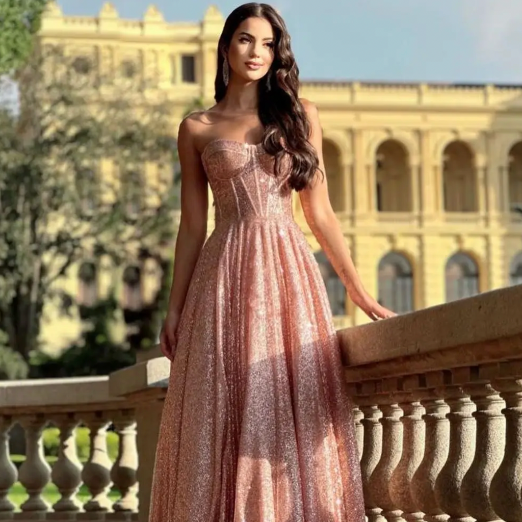 Look your best in this daring Robe Katana dress. Featuring a scalloped neckline and sequined beading, you'll glide in elegance and poise. With a lace-up A-line floor length design, make an unforgettable entrance at your next formal event. Take the plunge and take on the night!