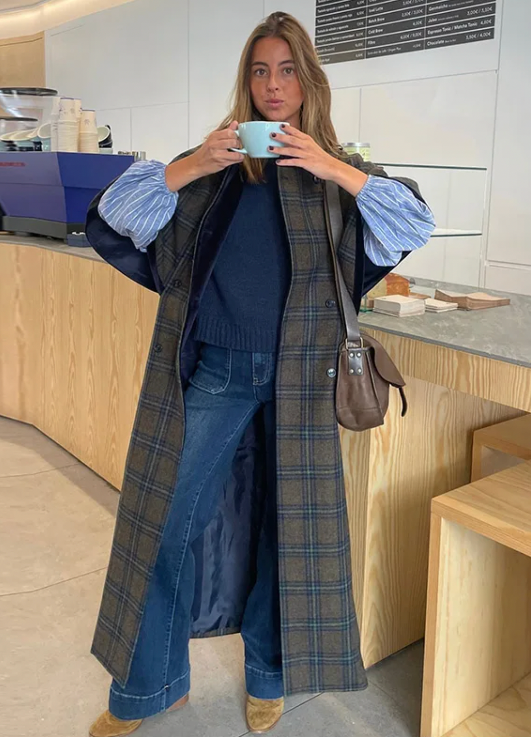 Experience timeless elegance with the Brynne Coat, crafted from a cozy wool blend for warmth and durability. Its maxi trench style features a stylish cape overlay, creating a relaxed fit that layers effortlessly over your favorite outfits. Designed to keep you comfortable on crisp autumn days, this coat blends vintage charm with contemporary flair, making it an indispensable piece for elevating your wardrobe with sophistication and comfort.