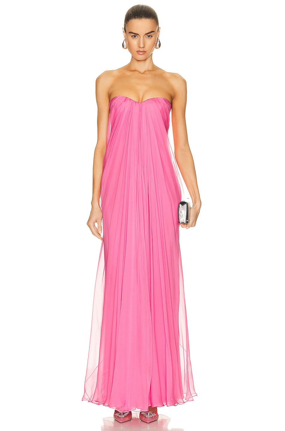 Get ready to turn heads in this stunning McQueen Draped Bustier Dress in Sugar Pink! The beautifully draped bustier adds a touch of elegance, while the striking color is sure to make a statement. Perfect for special occasions, this dress will make you feel confident and glamorous.