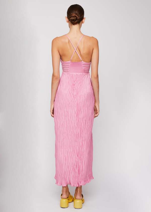 The Angelina Dress by A.L.C combines elegant design with thoughtful details. Crafted from smooth sateen pliss fabric, it features a delicate lettuce hem that adds subtle texture. Fully lined for comfort and modesty, the dress includes a hidden side zipper for a seamless appearance. The smocked back panels ensure a flexible, flattering fit, while adjustable shoulder straps allow you to tailor the dress to your body. Perfect for those who want a refined, versatile look with expert craftsmanship.