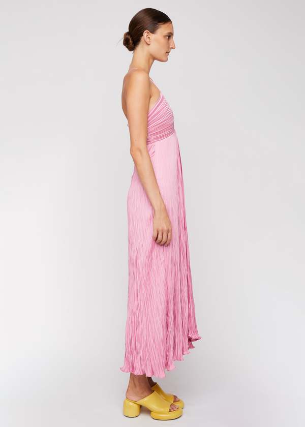 The Angelina Dress by A.L.C combines elegant design with thoughtful details. Crafted from smooth sateen pliss fabric, it features a delicate lettuce hem that adds subtle texture. Fully lined for comfort and modesty, the dress includes a hidden side zipper for a seamless appearance. The smocked back panels ensure a flexible, flattering fit, while adjustable shoulder straps allow you to tailor the dress to your body. Perfect for those who want a refined, versatile look with expert craftsmanship.