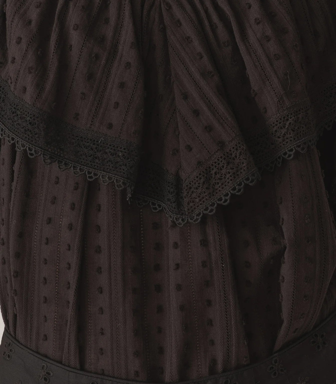 Experience effortless elegance with the Cosenza Top by Doen, crafted from vintage-inspired cotton-voile dobby for a lightweight, breathable feel. Its breezy cut and subtle V-neckline framed by a wide ruffle bring a touch of femininity, enhanced by intricate lace and delicate scallop trims. Oversized flutter sleeves add movement and charm, making it perfect for both casual days or dressing up. Style it loose for a relaxed vibe or tuck it into high-waisted jeans to elevate your look. 