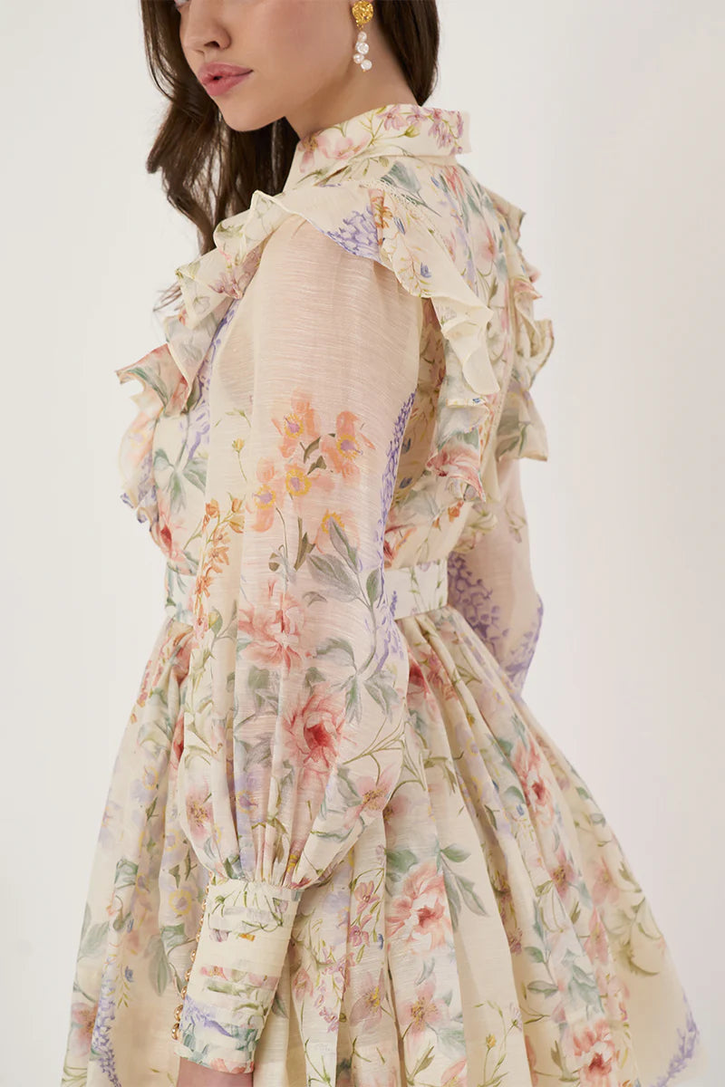 Indulge in luxury with the Bouquet Mini Dress. Made from premium silk-linen, this&nbsp; favorite features a flattering button-up design, blouson full-length sleeves with pearlised cuff buttons, and a detachable belt for a playful touch. A perfect mini-length with a side zipper opening completes the elevated look.