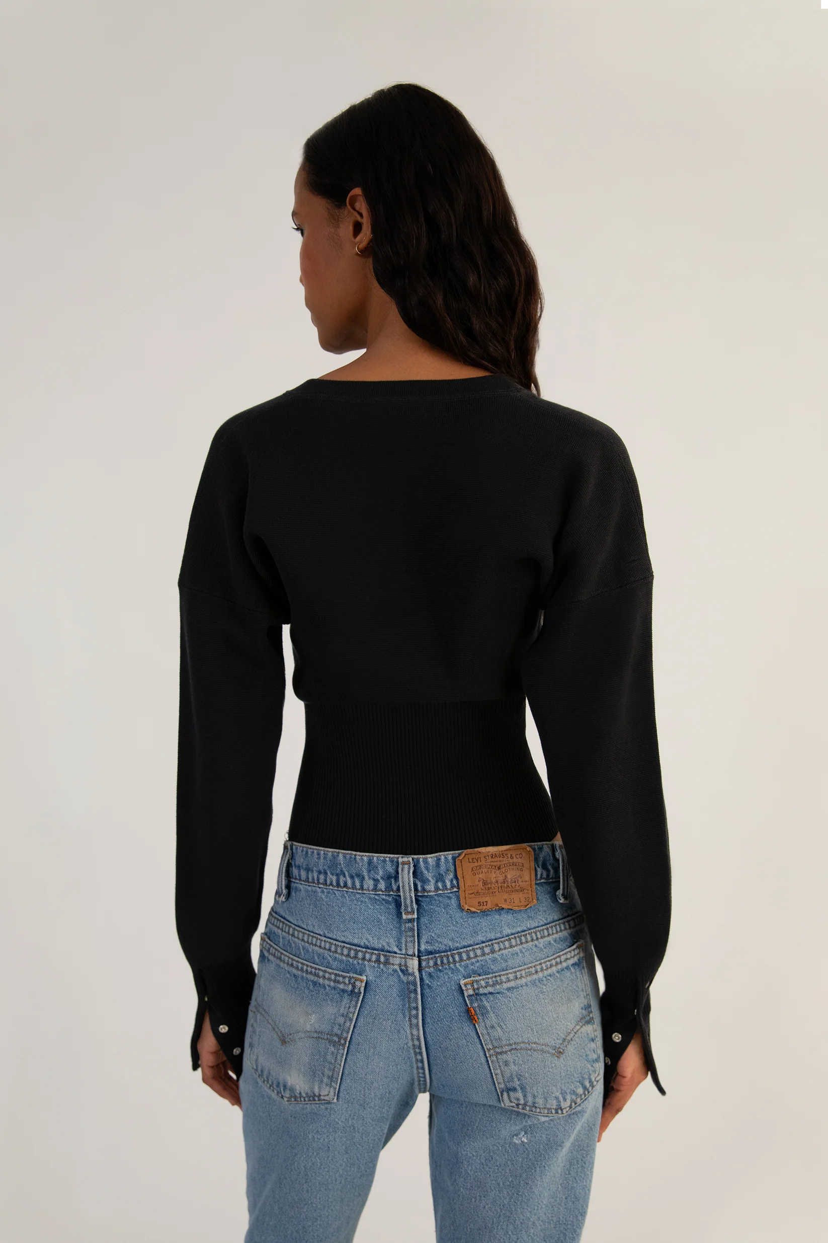 Elevate your style with The Weekend Knit Cardigan by Orseund Iris. Made from a luxurious blend of cotton and silk, this chunky Milano knit cardigan adds volume at the shoulders and cinches at the waist for a flattering silhouette. With its long and dramatic sleeves, it's the perfect addition to your wardrobe for a touch of sophisticated elegance.