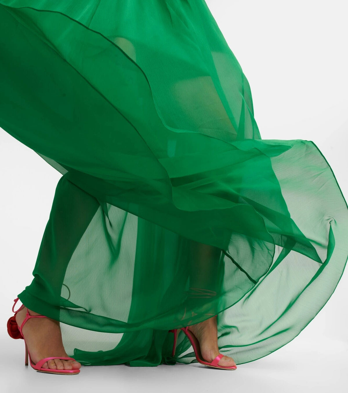 Indulge in ethereal elegance with the Cutout Chiffon Gown from Rasario. Crafted from airy chiffon with molded cups and a cutout bodice, this gown exudes sensuality. The transparent pleated skirt adds a touch of grace, making you the belle of the ball.