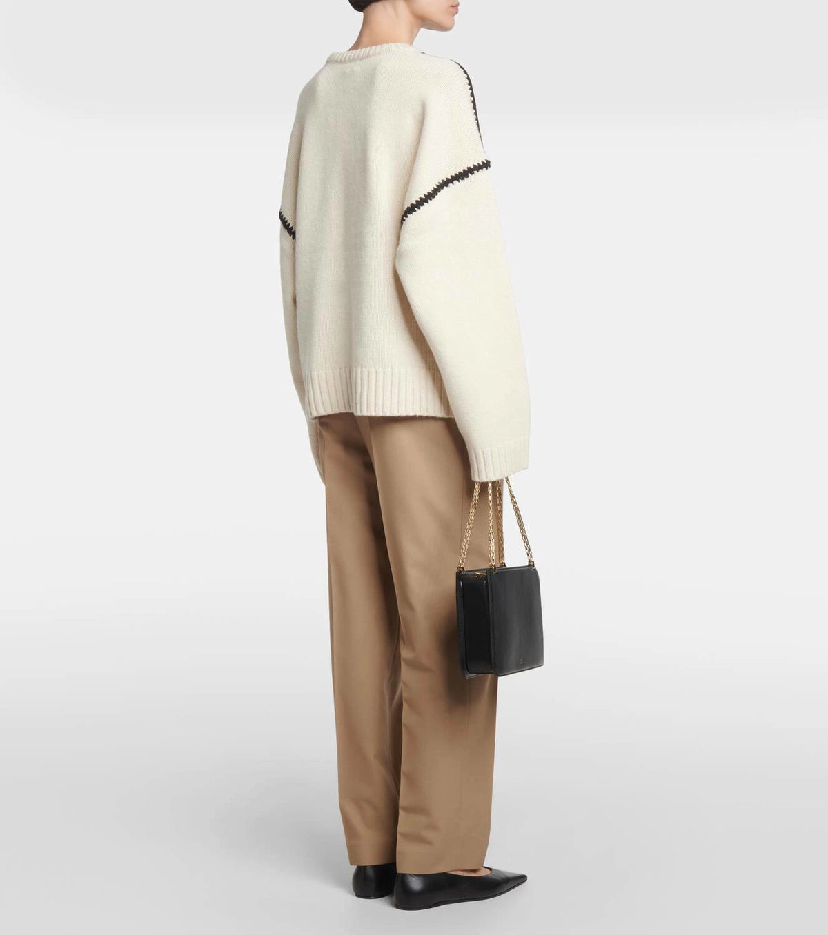 Discover understated elegance with this embroidered wool and cashmere sweater by Totême. Crafted in a wide silhouette from mid-weight wool blended with cashmere, it provides exceptional warmth and softness. The contrasting embroidery along the shoulders and armholes adds a refined artisanal touch, elevating your everyday knitwear with a distinctive, modern flair. Perfectly embodying Scandinavian minimalism, this sweater offers both comfort and style for a timeless, versatile wardrobe staple.