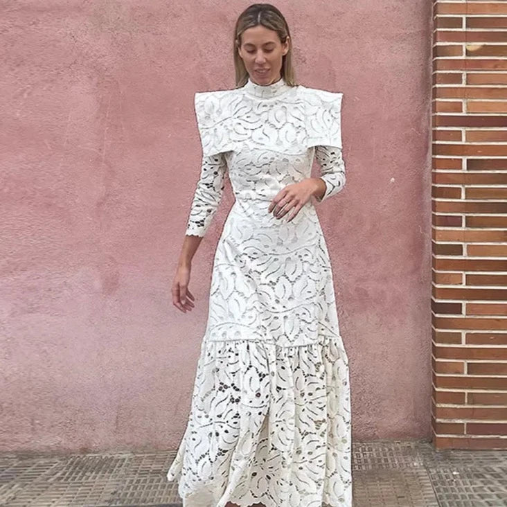 Discover elegant and timeless style in our Rosette Maxi Dress. Crafted with solid, high-quality lace, this dress features a slimming silhouette and long sleeves for a sophisticated look. The high waist adds a feminine touch to this must-have piece. Perfect for any special occasion.